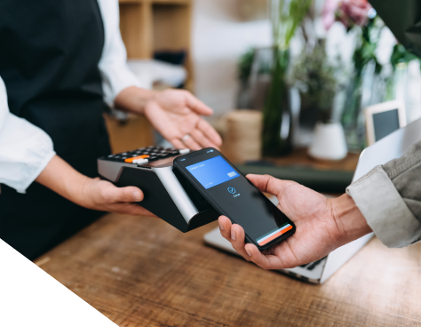 a hand using his phone to pay at a credit card machine