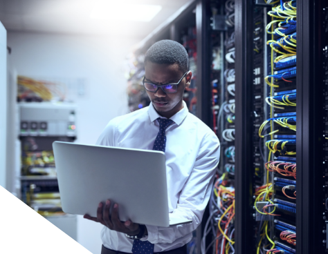 a man working in a server room
