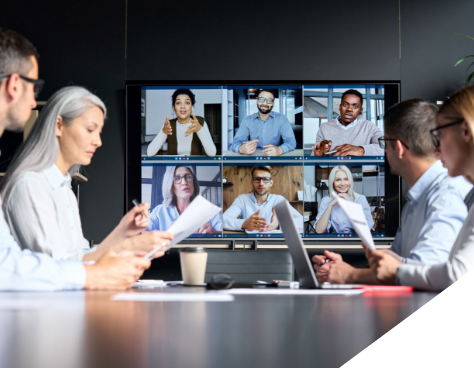a conference room full of people on a video conference call