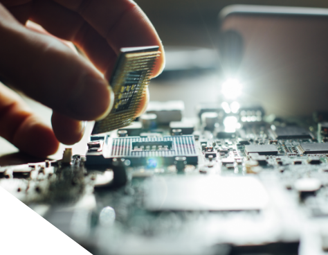 A close up photo of a person putting a CPU on a motherboard