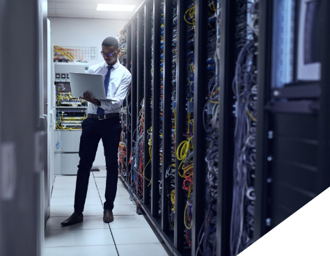A man working in a server room