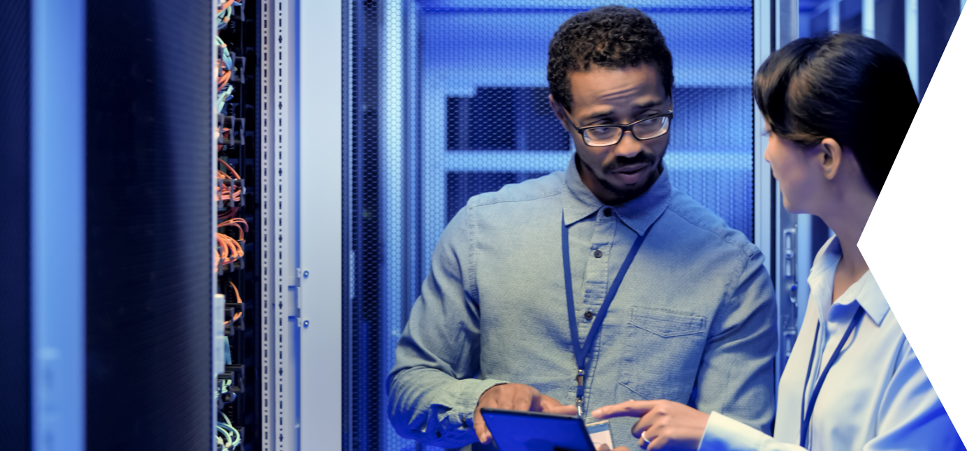 A man and woman discussing something in a Server Room